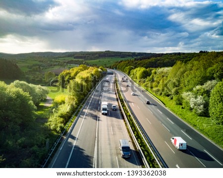 Highway in Germany with cars and sky with big clouds