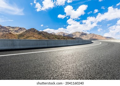 Highway Ground And Mountain Natural Scenery Under Blue Sky.Landscape And Highway.Outdoor Road Background.