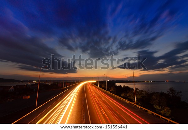 Highway to\
heaven - night road with light\
trails
