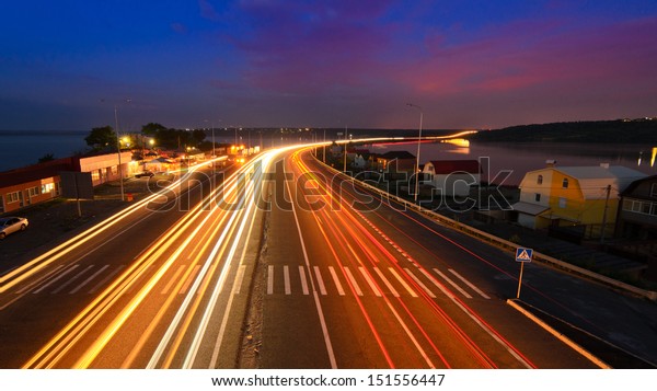 Highway to\
heaven - night road with light\
trails