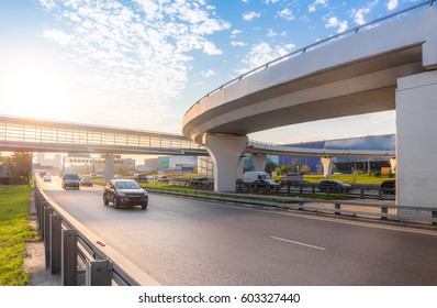 Highway Interchange With Bridge On The Background