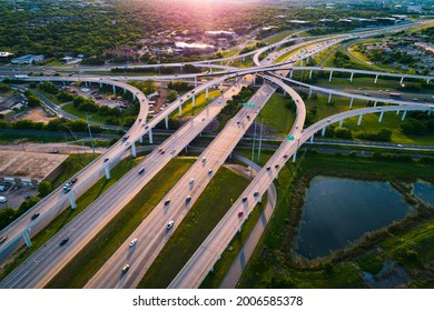 Highway Interchange loops and turnarounds , travel destination and following the busy highway system aerial drone look looking down from above curved raised roadways in Austin Texas USA