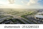 Highway intersection with overpass between interstate I-35, Monarch Hwy and West Parmer Lane in North Austin, busy traffic at peak hour, large suburban shopping center, apartment complex, aerial. USA