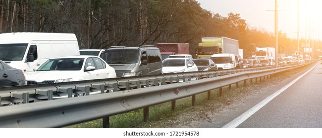 Highway Interstate Road With Car Traffic Jam And Tree Forest On Background. Motorway Bumber Barrier Gridlock Due Country Border Control Point. Vehicle Crash Accident And Queue Bottleneck On Freeway