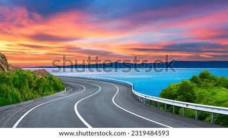 highway landscape at colorful sunset. Road view on the sea. colorful seascape with beautiful road. Way view on ocean beach. coastal road in europe. Beautiful nature scenery in the Mediterranean.