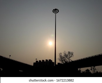 Highway lighting or spotlight towers on sky and blue sky background with copy space.Bottom-up shooting