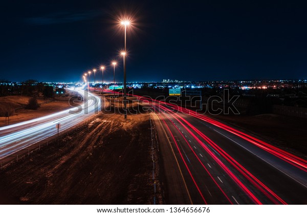 Highway\
at Night With Car Light Streaks (Long\
Exposure)