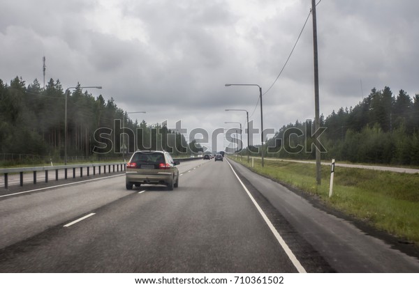 Highway\
in northern Europe. View through the\
windshield
