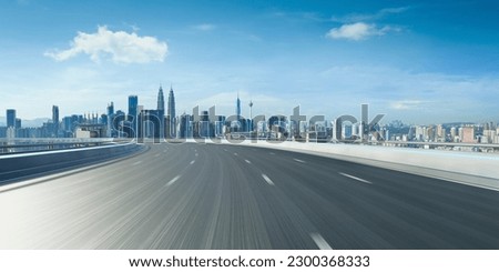Highway overpass motion blur with city background .