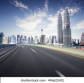 Highway Overpass Motion Blur With Kl City Background