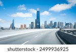 Highway overpass motion blur with  modern city skyline with buildings under blue sky