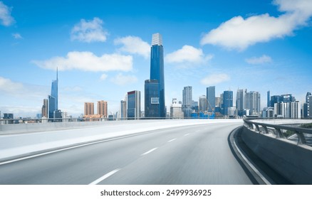 Highway overpass motion blur with  modern city skyline with buildings under blue sky - Powered by Shutterstock