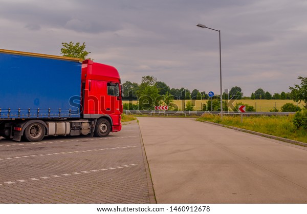 Highway parking / Germany - 07 Junly, 2019: Red\
DAF  XF Truck on the\
parking.