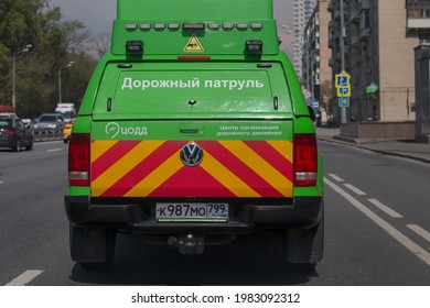 Highway Patrol With Traffic Management Center Text In Russian. Green Highway Patrol With Yellow-red Pattern Inspecting The Road, Back View: Moscow, Russia - May 2021