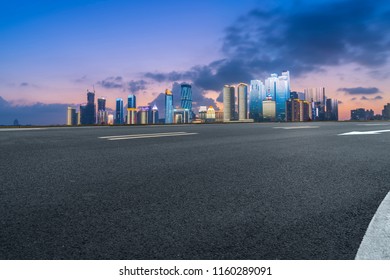 Highway pavement and skyline of Qingdao urban construction

 - Shutterstock ID 1160289091