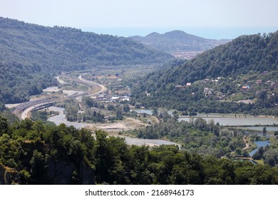 A Highway In A Picturesque Mountainous Area Along A Clear Blue River. Sochi, Krasnaya Polyana, Russia.