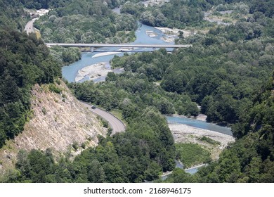 A Highway In A Picturesque Mountainous Area Along A Clear Blue River. Sochi, Krasnaya Polyana, Russia.