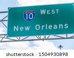 Highway road i10 west interstate 10 with direction sign and text on street for New Orleans in Lousiana with symbol