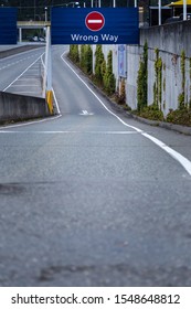 A Highway Road Sign That Says Wrong Way.