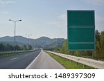 Highway and  road signs at cloudy day.