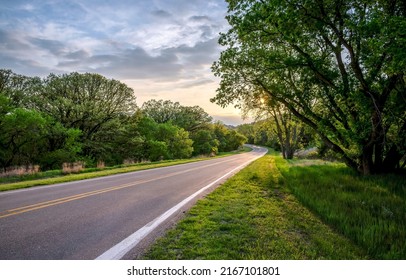 Highway road through the forest at dawn. Highway road in forest - Shutterstock ID 2167101801