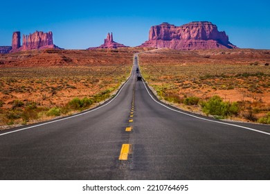 Highway Road U.S. Highway 163 and Monument Valley at sunset, Arizona, United States - Powered by Shutterstock