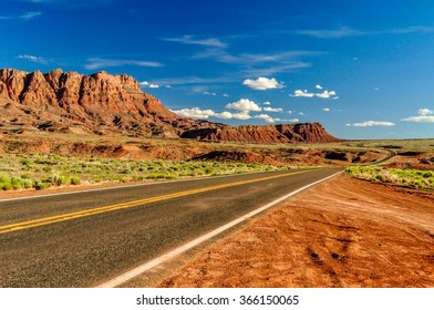 A highway runs along the red-sandstone Echo Cliffs near Page, Arizona. - Shutterstock ID 366150065