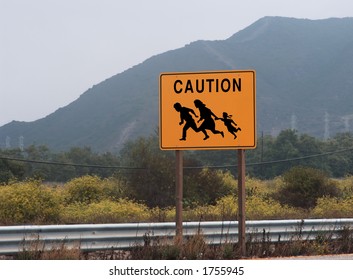 Highway Sign Showing Family Crossing