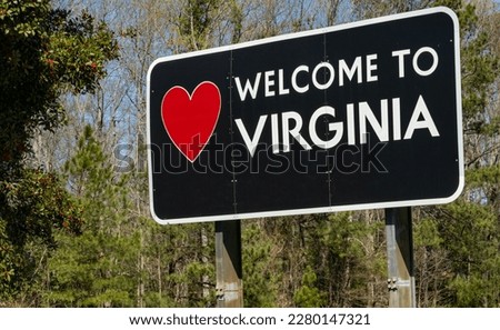 A highway sign welcomes drivers to the US commonwealth of Virginia.