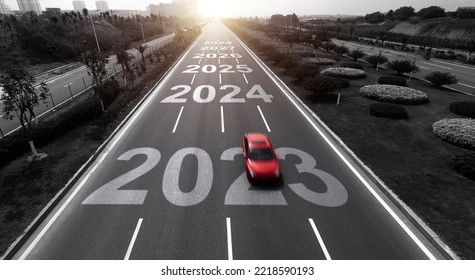 Highway With Single Red Car, And Number 2023, 2024 To 2028 On The Road