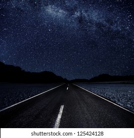 Highway And Starry Night In Desert