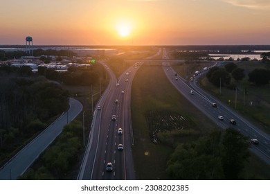 A highway with a sunset in the background