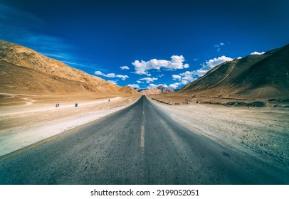 Highway through the canyon desert. Open range highway road. Asphalt road in desert. Highway road panorama