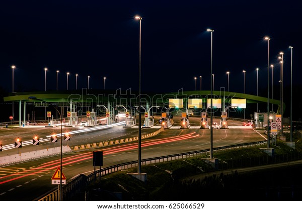 highway toll booth at\
night