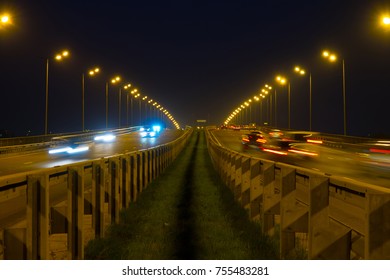 Highway traffic cars at night blured. Cars moving on road on bridge evening blurry. - Shutterstock ID 755483281