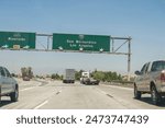 Highway traffic towards San Bernardino and Los Angeles with exit to Riverside. California, United States