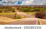 A highway traversing an agriculture area in the Oklahoma panhandle.