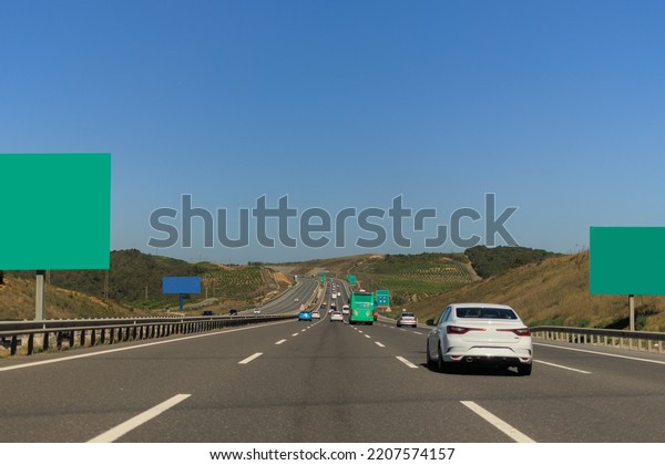 Highway wide road, transport and blue sky with clouds\
on a summer day