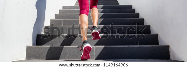 Hiit\
workout cardio running up the stairs training. Staircase climbing\
run woman going run up steps panorama banner. Runner athlete doing\
cardio sport workout. Activewear leggings and\
shoes.