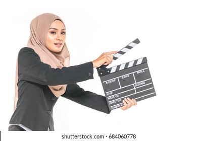 Hijab Girl Holding A Clapper Board. Filmmaking Or Film Production Concept