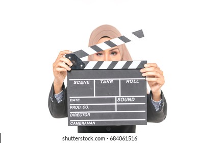 Hijab Girl Holding A Clapper Board. Filmmaking Or Film Production Concept