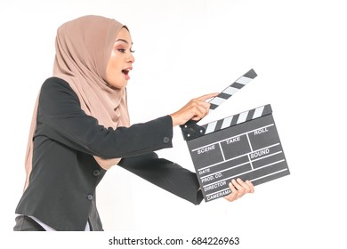 Hijab Girl Holding A Clapper Board. Filmmaking Or Film Production Concept