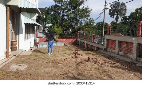 Hijab And Mask Wearing Malay Woman Walking In An Abandoned House During The Pandemic