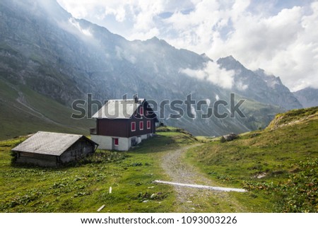 Hike in Swiss Alps with nature views; shepherd's house in mountains; cable car station; chalet