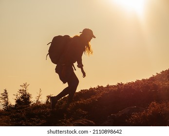 Hike travel Asian hiker woman carrying heavy backpack tired on outdoor trek in Grand Canyon trail walking up the mountain. Active healthy lifestyle.