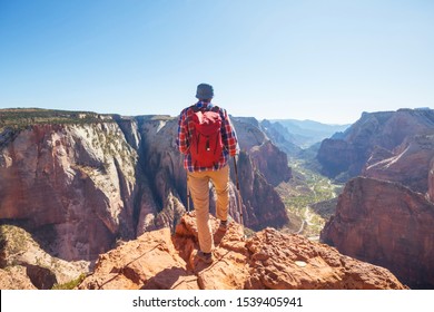 Hike In Zion National Park. Man Walk On The Trail  In Zion National Park,Utah. Back Turned No Face Visible.