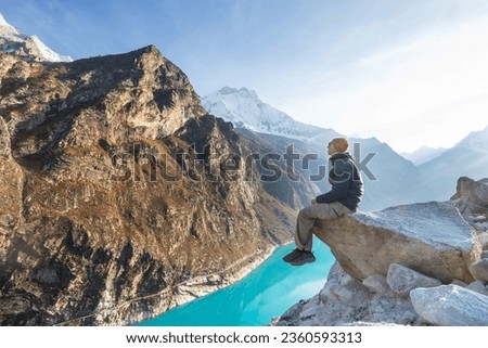 Hiker admires the lake  Paron in Cordillera Blanca,  Peru, South America