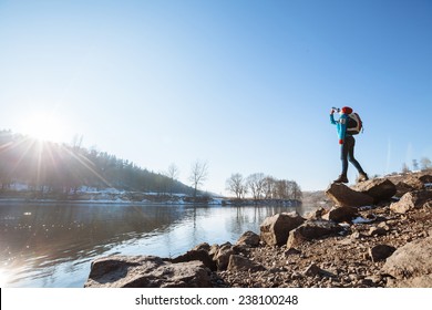 Hiker With A Backpack Hiking In The Nature During Sunset And Drink Water