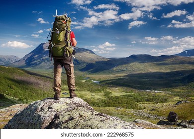 Hiker With Backpack In The Wilderness Of Northern Sweden