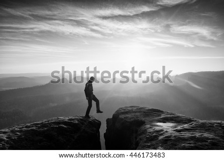 Similar – photographer in mountain at sunset